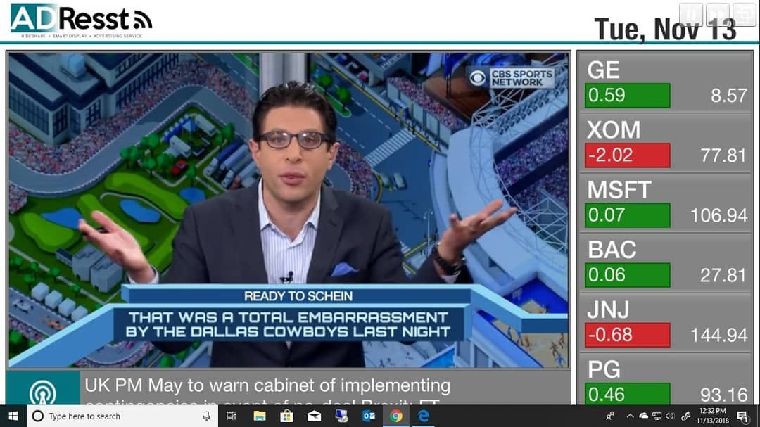 AdResst smart display interface showing video content, a news ticker, and a market data panel